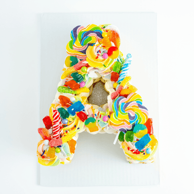 Rainbow Candy Letter Cake - Sweet E's Bake Shop