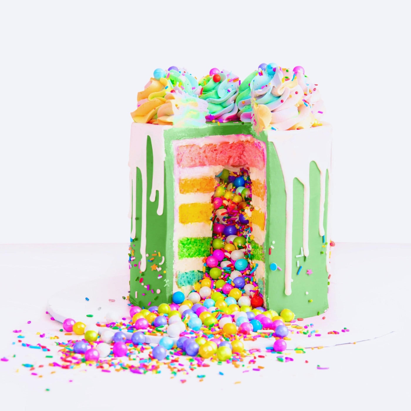 St. Patrick's Day Rainbow Candy Spill Cake - Sweet E's Bake Shop