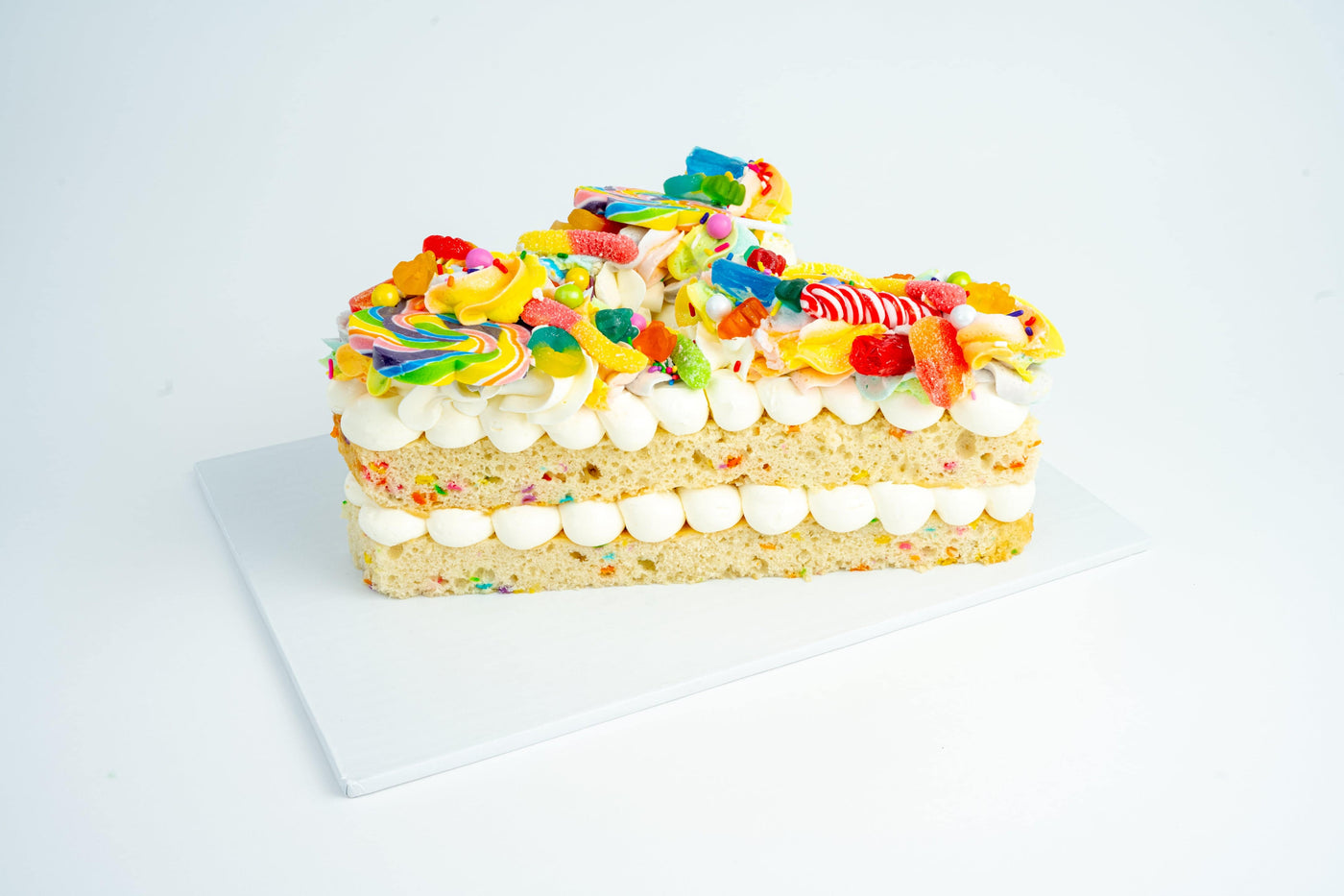 Rainbow Candy Letter Cake - Sweet E's Bake Shop
